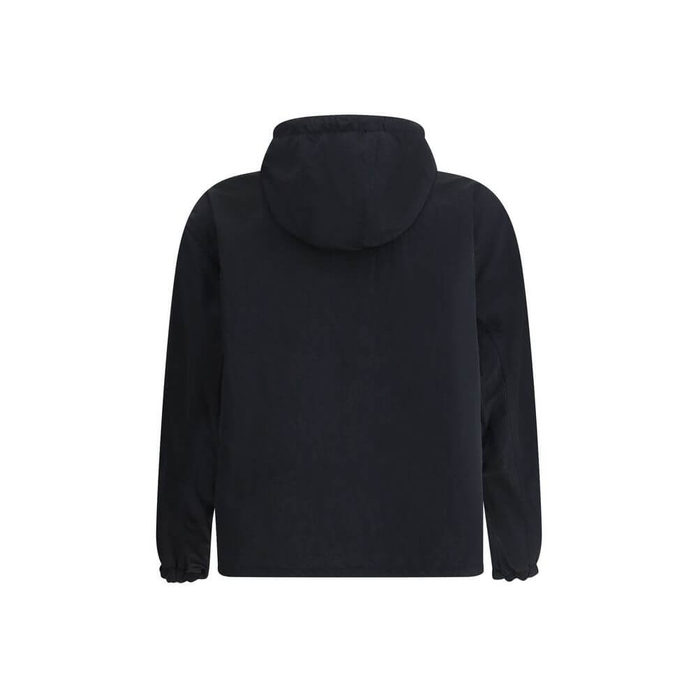 Reversible waterproof JacketBurberry’s reversible Waterproof Jacket is a versatile and functional garment perfect for any occasion. Featuring an adjustable drawstring hood and a front zipper closure, it offers practicality and protection. The two side wel