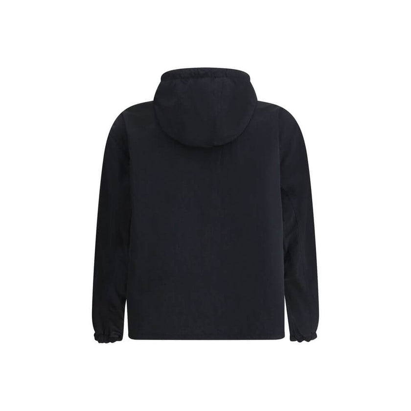 Reversible waterproof JacketBurberry’s reversible Waterproof Jacket is a versatile and functional garment perfect for any occasion. Featuring an adjustable drawstring hood and a front zipper closure, it offers practicality and protection. The two side wel