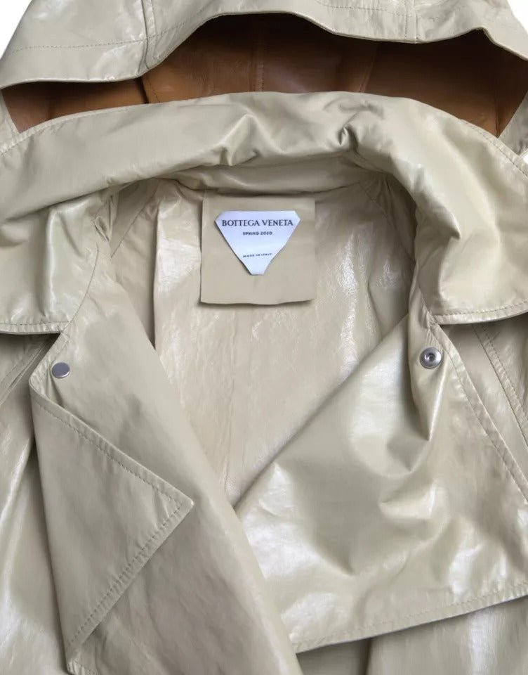 Beige Lambskin Leather Trench Coat JacketBOTTEGA VENETA Absolutely stunning, 100% Authentic, brand new with tags BOTTEGA VENETA trench coat waterproof jacket. Model: Trench coat jacket Colour: Black Material: 100% Calf Leather Full button closure Logo det