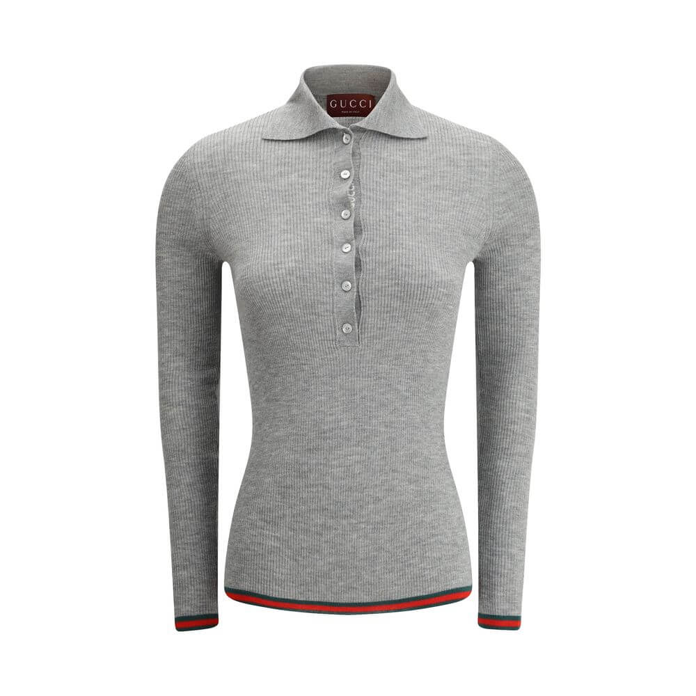 Gray Cashmere TopGucci’s Cashmere Polo Sweater is an elegant and sophisticated piece, crafted from soft cashmere for superior comfort. The long-sleeved style features a classic collar and tone-on-tone buttons on the front, adding an understated touch of s