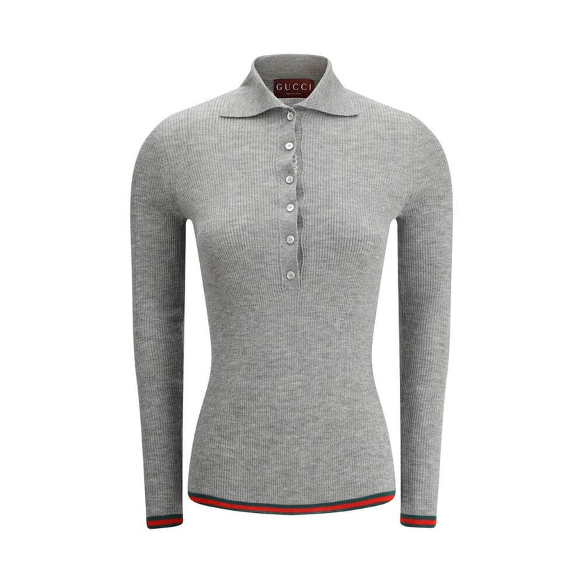 Gray Cashmere TopGucci’s Cashmere Polo Sweater is an elegant and sophisticated piece, crafted from soft cashmere for superior comfort. The long-sleeved style features a classic collar and tone-on-tone buttons on the front, adding an understated touch of s