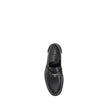 Black Calf Leather Bos Taurus Slip-On LoafersPrada’s leather Loafers are a mix of classic elegance and distinctive details. The slightly elongated round toe and leather block heel ensure comfort and style. The iconic enameled triangular plaque with the br