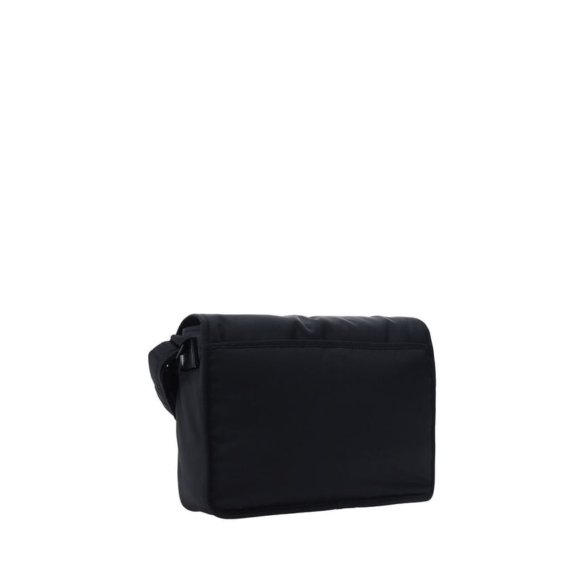 Black Polyamide Shoulder BagNiki Camera Shoulder Bag by Saint Laurent, front closure by magnetic flap, all-over padded and quilted chévron fabric design, embossed and matching iconic YSL brand logo plaque on front, triple interior compartment, removable a