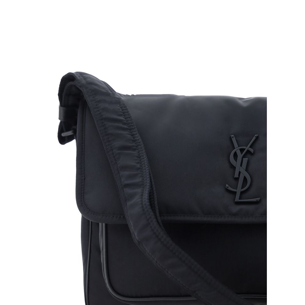 Black Polyamide Shoulder BagNiki Camera Shoulder Bag by Saint Laurent, front closure by magnetic flap, all-over padded and quilted chévron fabric design, embossed and matching iconic YSL brand logo plaque on front, triple interior compartment, removable a