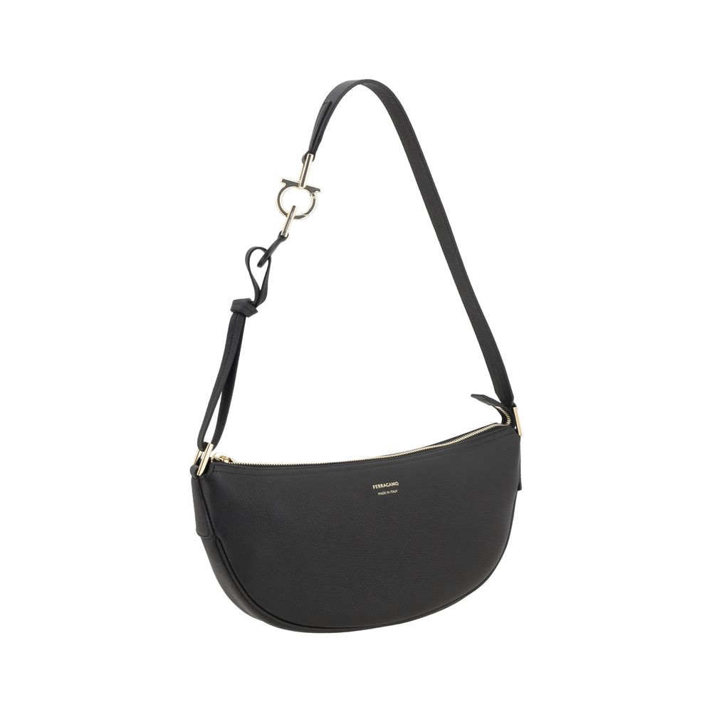 Black Calf Leather Bos Taurus Shoulder BagFerragamo’s Leather Hobo Shoulder Bag is an elegant and versatile accessory, featuring a half-moon design that enhances its soft, flowing silhouette. The adjustable shoulder strap allows you to easily adjust it to