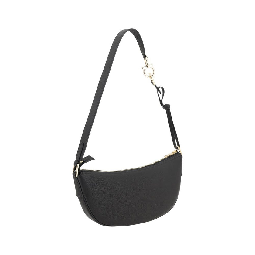 Black Calf Leather Bos Taurus Shoulder BagFerragamo’s Leather Hobo Shoulder Bag is an elegant and versatile accessory, featuring a half-moon design that enhances its soft, flowing silhouette. The adjustable shoulder strap allows you to easily adjust it to
