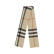 Beige Wool ScarfBurberry’s wool Scarf is a classic accessory that combines warmth and style. Featuring frayed hems and the famous all-over repeated Archivio Check pattern, it represents the excellence of the brand’s iconic design. Perfect for those lookin