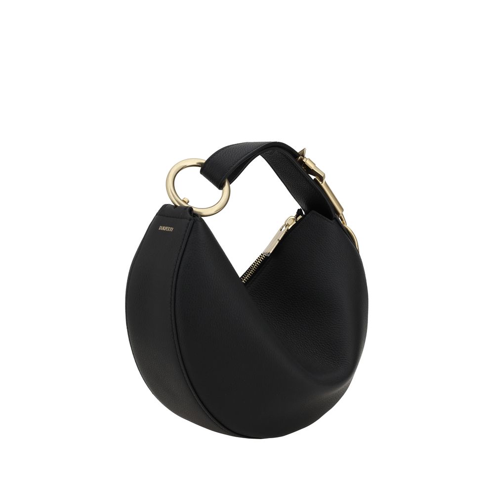 Leather HandbagBurberry’s Leather Handbag is a sleek and sophisticated design featuring the brand’s iconic details. The zippered top closure provides added security, while the adjustable flat handle offers versatility in wearing it. The Equestrian Knight
