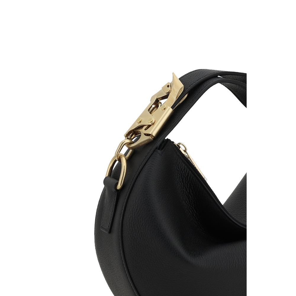 Leather HandbagBurberry’s Leather Handbag is a sleek and sophisticated design featuring the brand’s iconic details. The zippered top closure provides added security, while the adjustable flat handle offers versatility in wearing it. The Equestrian Knight
