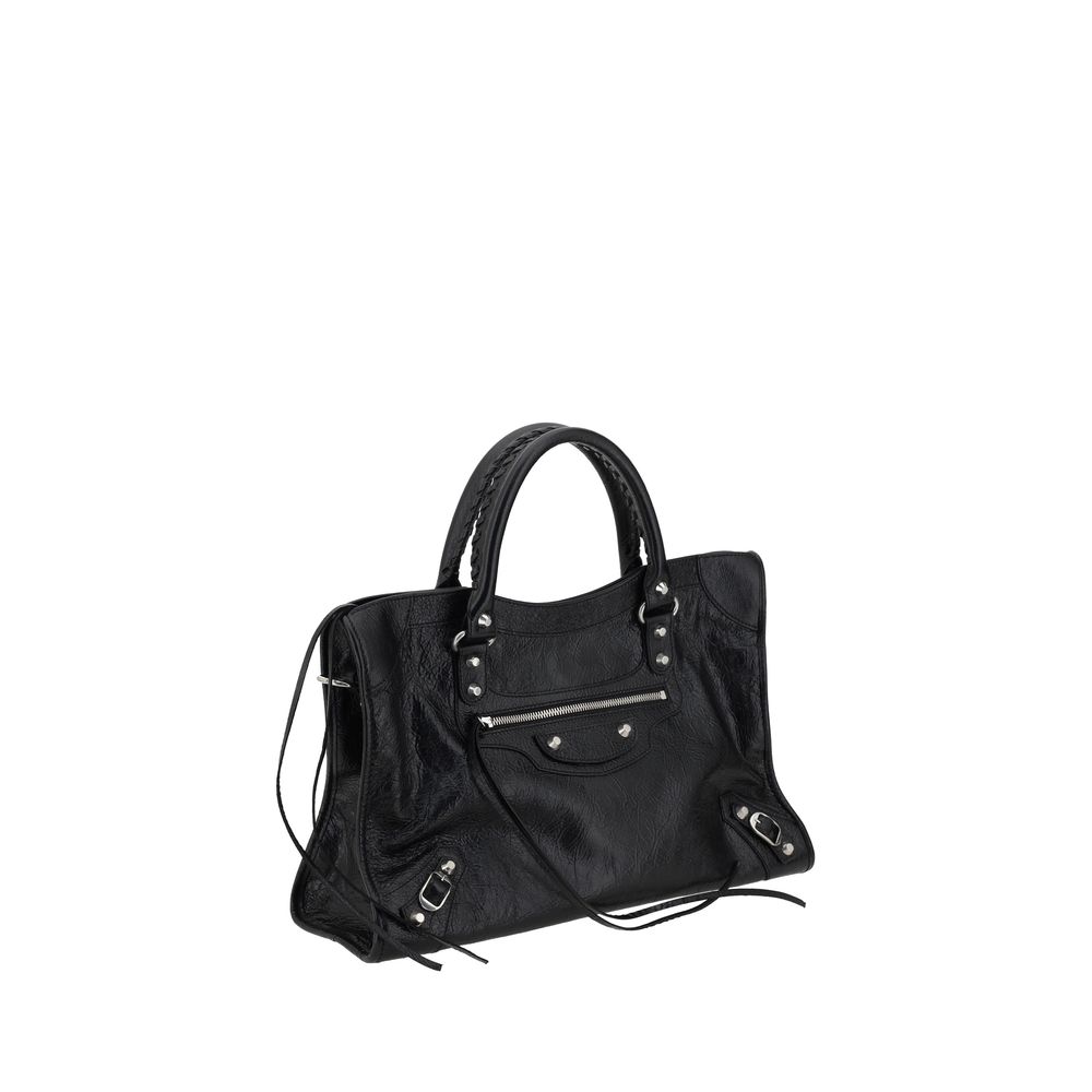 Black Lamb Ovis Aries Aries Shoulder BagBalenciaga’s Le City Medium Lambskin Handbag combines elegance and functionality. Made of soft lambskin leather, it features two hand-woven leather handles and an adjustable, removable shoulder strap for added versa