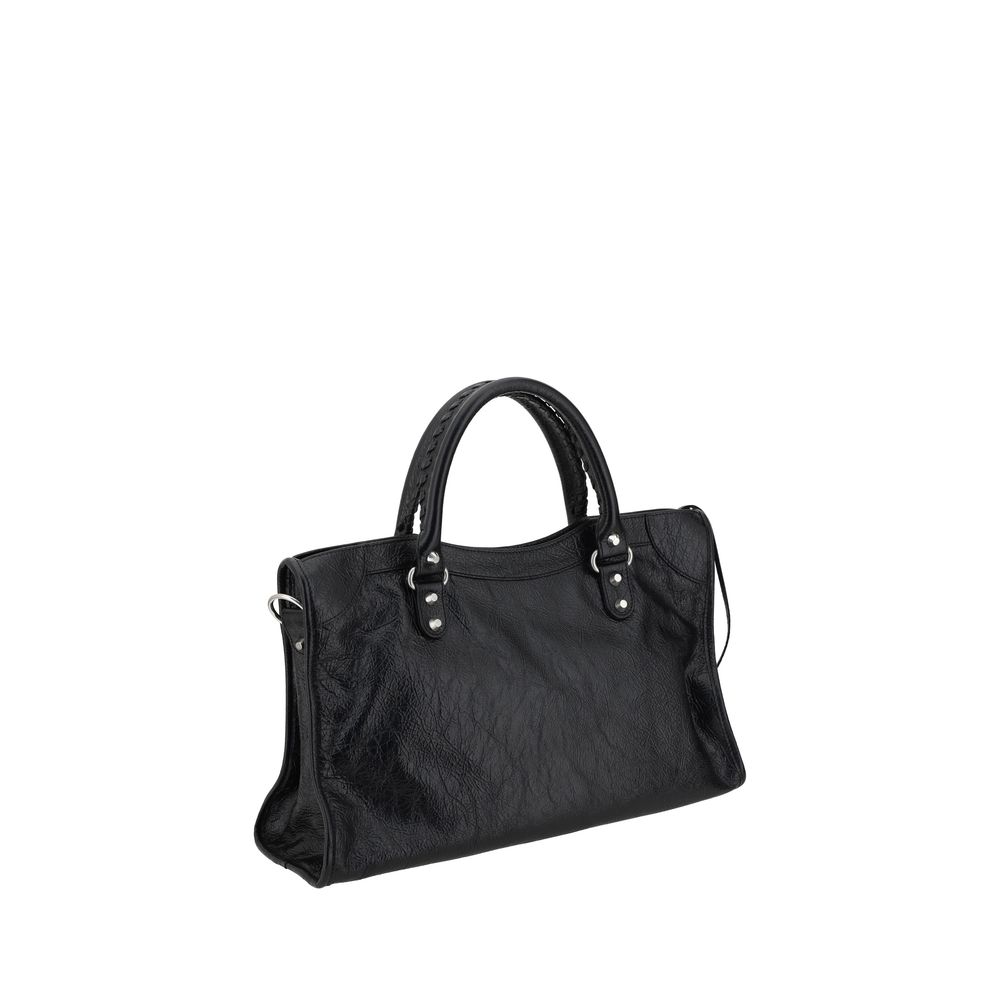 Black Lamb Ovis Aries Aries Shoulder BagBalenciaga’s Le City Medium Lambskin Handbag combines elegance and functionality. Made of soft lambskin leather, it features two hand-woven leather handles and an adjustable, removable shoulder strap for added versa