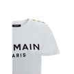 Logoed T-ShirtBalmain’s cotton T-Shirt combines the minimalism of a monochrome pattern with the elegance of the Maison’s iconic details. Made of soft cotton, it features a ribbed crew neck and a regular fit designed for everyday comfort. The design is enr