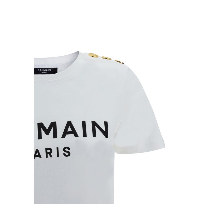 Logoed T-ShirtBalmain’s cotton T-Shirt combines the minimalism of a monochrome pattern with the elegance of the Maison’s iconic details. Made of soft cotton, it features a ribbed crew neck and a regular fit designed for everyday comfort. The design is enr