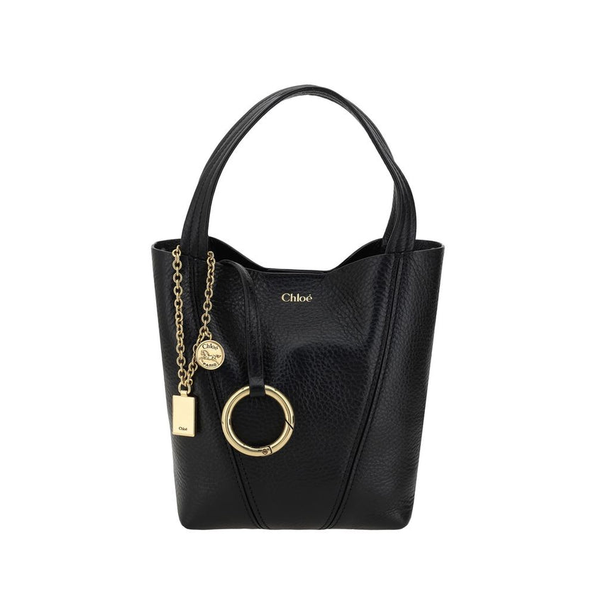 Black Calf Leather Bos Taurus Shoulder BagThe Spin Shoulder Bag by Chloé, crafted by shiny grained leather, features an elegant design with two flat top handles and an adjustable shoulder strap. The closure is secured by a magnetic button, while the detai