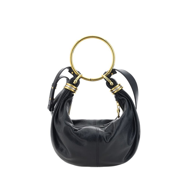 Black Calf Leather Bos Taurus HandbagLeather Bracelet Handbag by Chloé, a round brass handle, an adjustable flat shoulder strap and removable top zipper closure, single interior compartment. Season: AW25 Dimension: 32x32x10 Composition: 100% Calf Leather