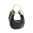 Black Calf Leather Bos Taurus HandbagLeather Bracelet Handbag by Chloé, a round brass handle, an adjustable flat shoulder strap and removable top zipper closure, single interior compartment. Season: AW25 Dimension: 32x32x10 Composition: 100% Calf Leather