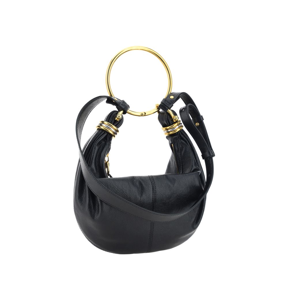 Black Calf Leather Bos Taurus HandbagLeather Bracelet Handbag by Chloé, a round brass handle, an adjustable flat shoulder strap and removable top zipper closure, single interior compartment. Season: AW25 Dimension: 32x32x10 Composition: 100% Calf Leather