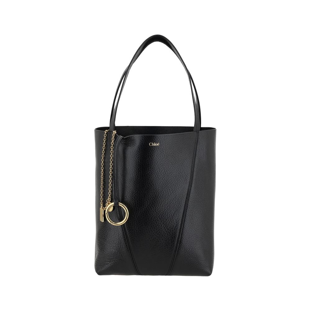 Black Calf Leather Bos Taurus Shoulder BagLeather Spin Shoulder Bag by Chloé is a refined and modern accessory featuring a sleek grained leather design. The two flat top handles offer a comfortable and practical grip, while the brand’s iconic monogram, pr