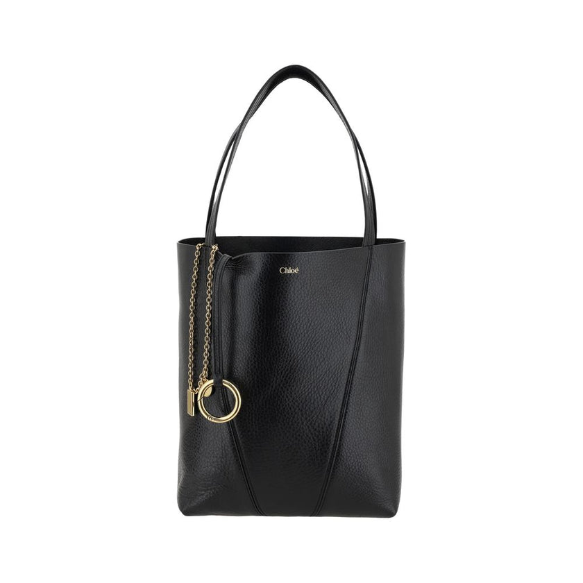 Black Calf Leather Bos Taurus Shoulder BagLeather Spin Shoulder Bag by Chloé is a refined and modern accessory featuring a sleek grained leather design. The two flat top handles offer a comfortable and practical grip, while the brand’s iconic monogram, pr
