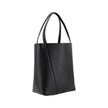 Black Calf Leather Bos Taurus Shoulder BagLeather Spin Shoulder Bag by Chloé is a refined and modern accessory featuring a sleek grained leather design. The two flat top handles offer a comfortable and practical grip, while the brand’s iconic monogram, pr