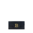 Black Calf Leather Bos Taurus WalletCalfskin Shoulder Wallet by Balmain, gold-plated chain shoulder strap, front closure by magnetic flap, maxi three-dimensional brand logo plaque applied on front, interior coin compartment, bill compartment and interior