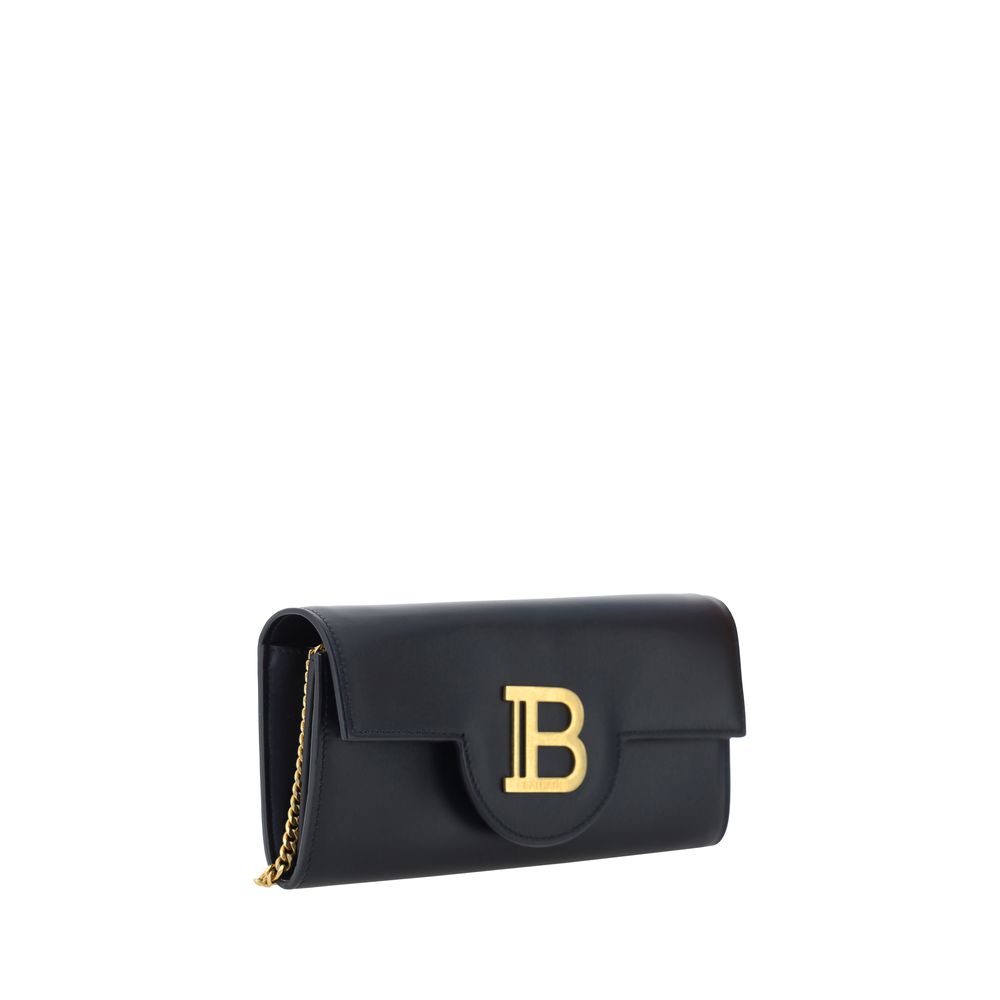 Black Calf Leather Bos Taurus WalletCalfskin Shoulder Wallet by Balmain, gold-plated chain shoulder strap, front closure by magnetic flap, maxi three-dimensional brand logo plaque applied on front, interior coin compartment, bill compartment and interior
