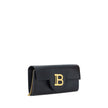 Black Calf Leather Bos Taurus WalletCalfskin Shoulder Wallet by Balmain, gold-plated chain shoulder strap, front closure by magnetic flap, maxi three-dimensional brand logo plaque applied on front, interior coin compartment, bill compartment and interior