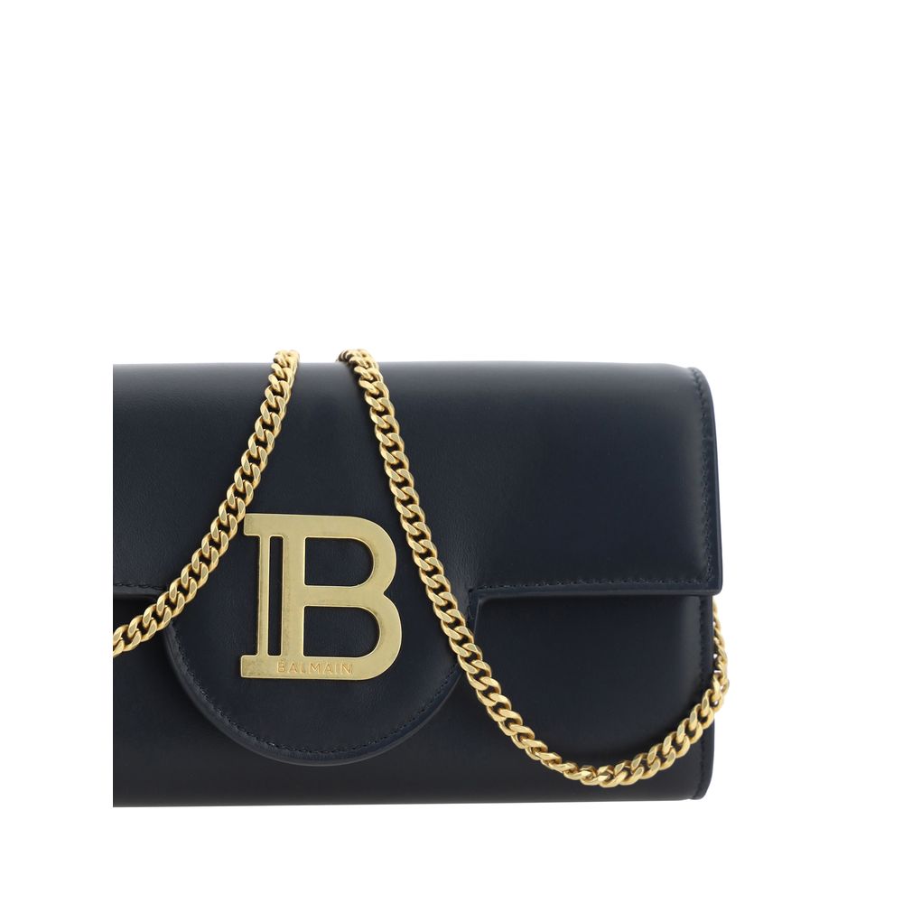 Black Calf Leather Bos Taurus WalletCalfskin Shoulder Wallet by Balmain, gold-plated chain shoulder strap, front closure by magnetic flap, maxi three-dimensional brand logo plaque applied on front, interior coin compartment, bill compartment and interior