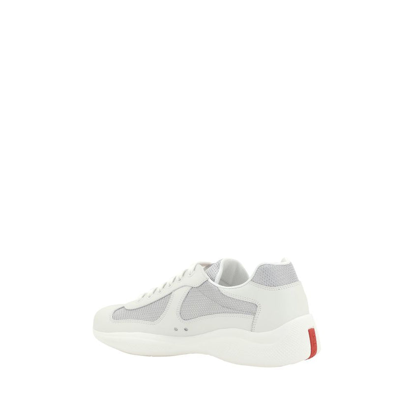 White Calf Leather Bos Taurus Low Top SneakersPrada’s America’s Sneakers are a modern and stylish interpretation of the classic sneaker, ideal for those seeking comfort without sacrificing style. Featuring a lace-up closure, they offer an adjustable and s