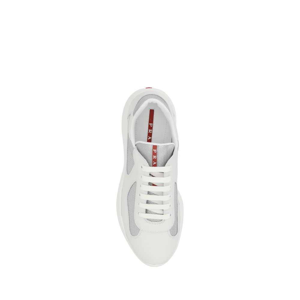 White Calf Leather Bos Taurus Low Top SneakersPrada’s America’s Sneakers are a modern and stylish interpretation of the classic sneaker, ideal for those seeking comfort without sacrificing style. Featuring a lace-up closure, they offer an adjustable and s