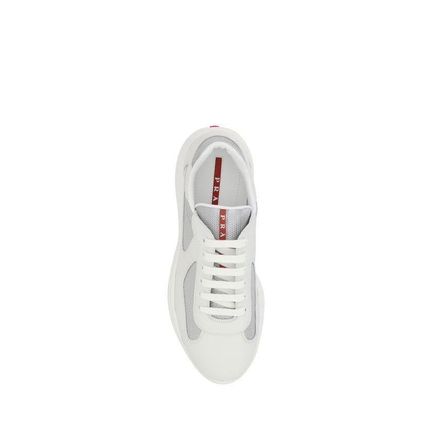 White Calf Leather Bos Taurus Low Top SneakersPrada’s America’s Sneakers are a modern and stylish interpretation of the classic sneaker, ideal for those seeking comfort without sacrificing style. Featuring a lace-up closure, they offer an adjustable and s