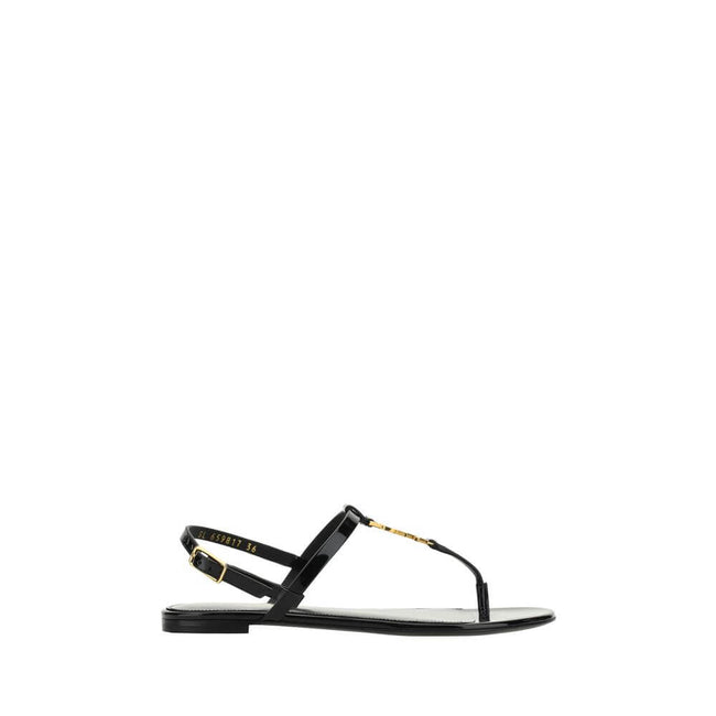 Black Calf Leather Bos Taurus Flat SandalsCalfskin Cassandra Sandals by Saint Laurent, flip-flop style, ankle strap closure with side buckle, iconic brand monogram detail embossed on front, logoed insole. Season: AW25 Composition: UPPER 100% Calf Leather