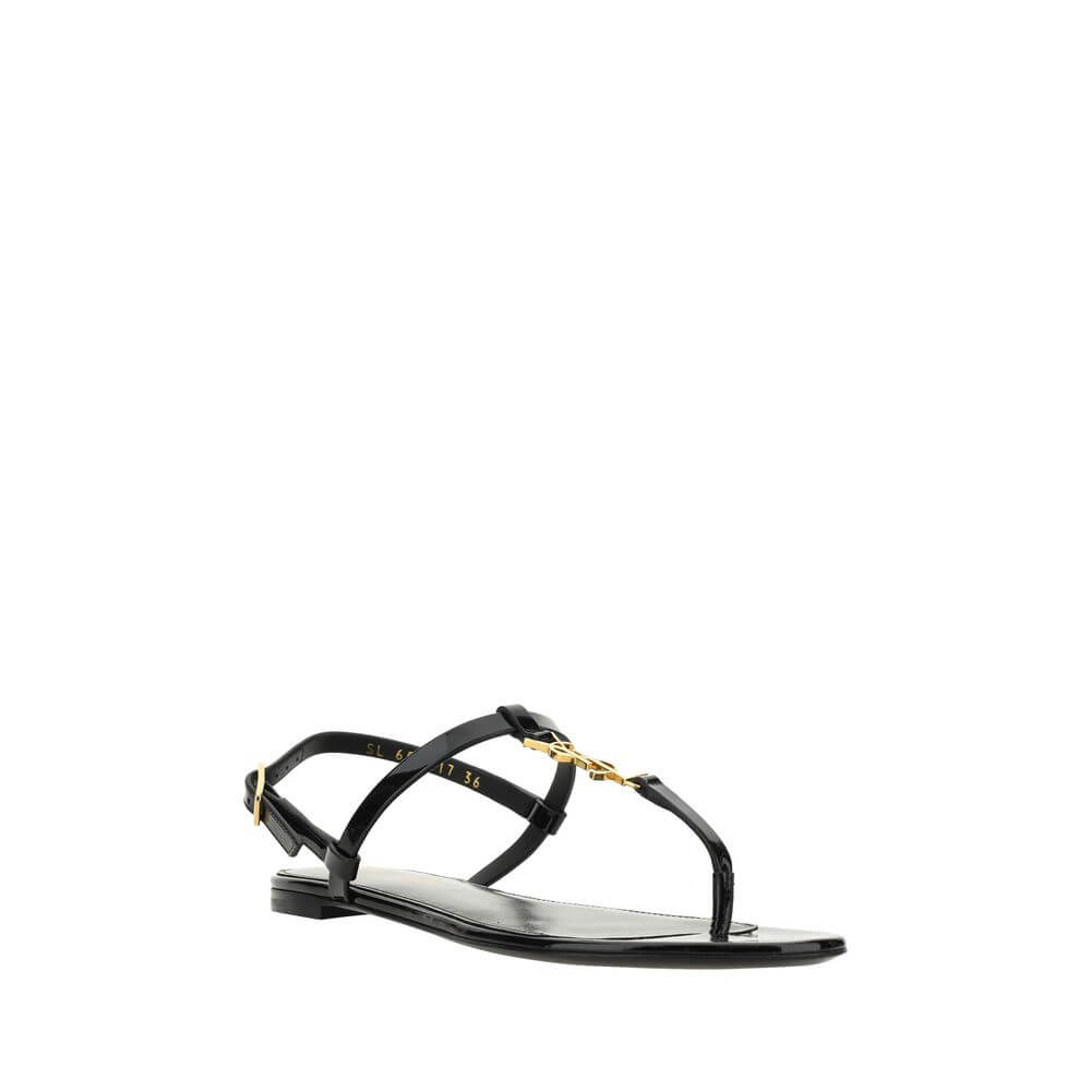 Black Calf Leather Bos Taurus Flat SandalsCalfskin Cassandra Sandals by Saint Laurent, flip-flop style, ankle strap closure with side buckle, iconic brand monogram detail embossed on front, logoed insole. Season: AW25 Composition: UPPER 100% Calf Leather