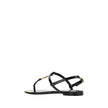 Black Calf Leather Bos Taurus Flat SandalsCalfskin Cassandra Sandals by Saint Laurent, flip-flop style, ankle strap closure with side buckle, iconic brand monogram detail embossed on front, logoed insole. Season: AW25 Composition: UPPER 100% Calf Leather