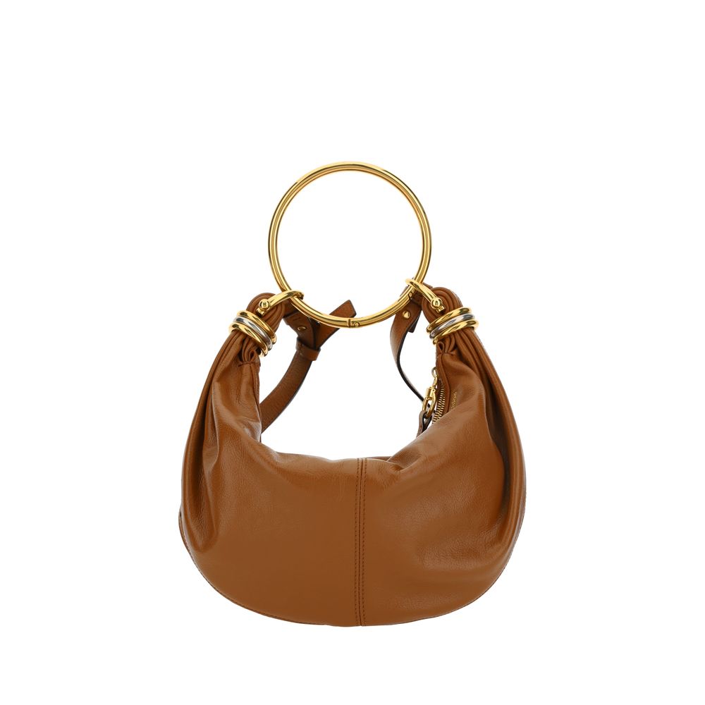 Brown Calf Leather Bos Taurus HandbagLeather Bracelet Handbag by Chloé, a round brass handle, an adjustable flat shoulder strap and removable top zipper closure, single interior compartment. Season: AW25 Dimension: 32x32x10 Composition: 100% Calf Leather