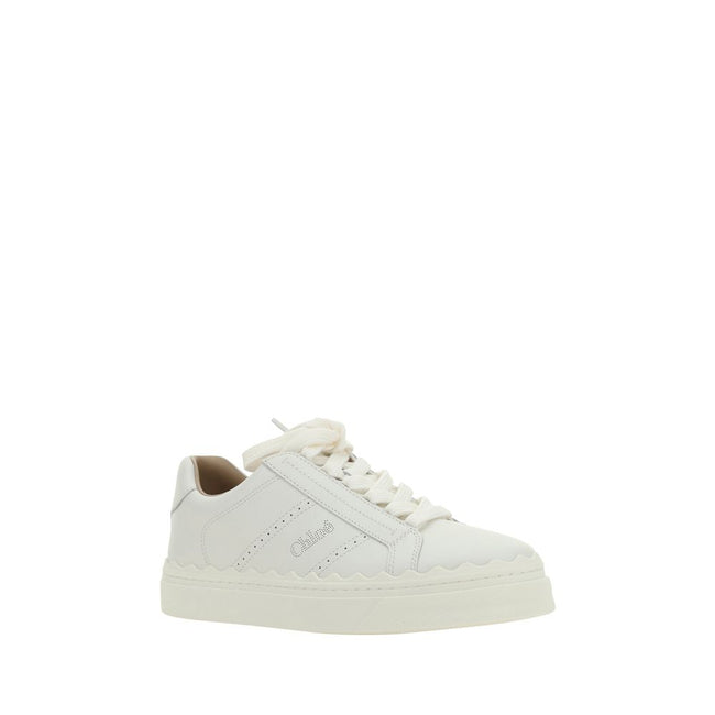 White Calf Leather Bos Taurus Low Top SneakersCalfskin Lauren Sneakers by Chloé, featuring lace-up front fastening, round toe, flat sole, perforated detailing on side panels, iconic brand monogram on front tongue and side panels, brand logo print on insol
