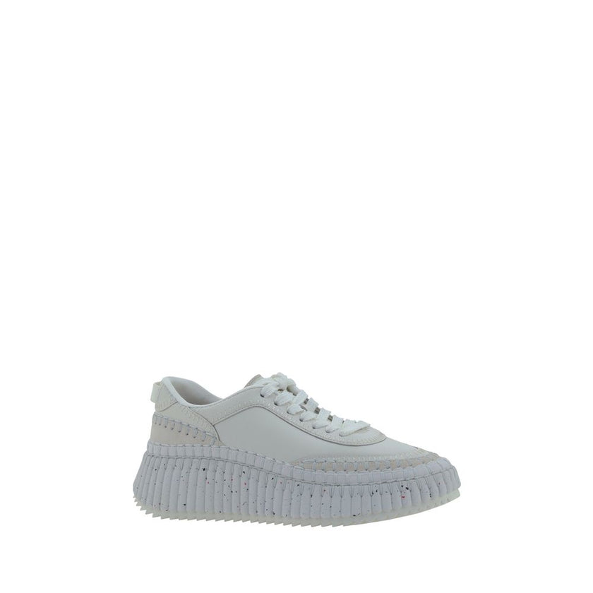 White Calf Leather Bos Taurus Platform SneakersCalfskin nama Sneakers by Chloé, lace-up front closure, mesh design on side panels, crater-effect structured platform sole, iconic brand monogram pressure-stamped at heel, logo-printed insole. Season: AW25 Co