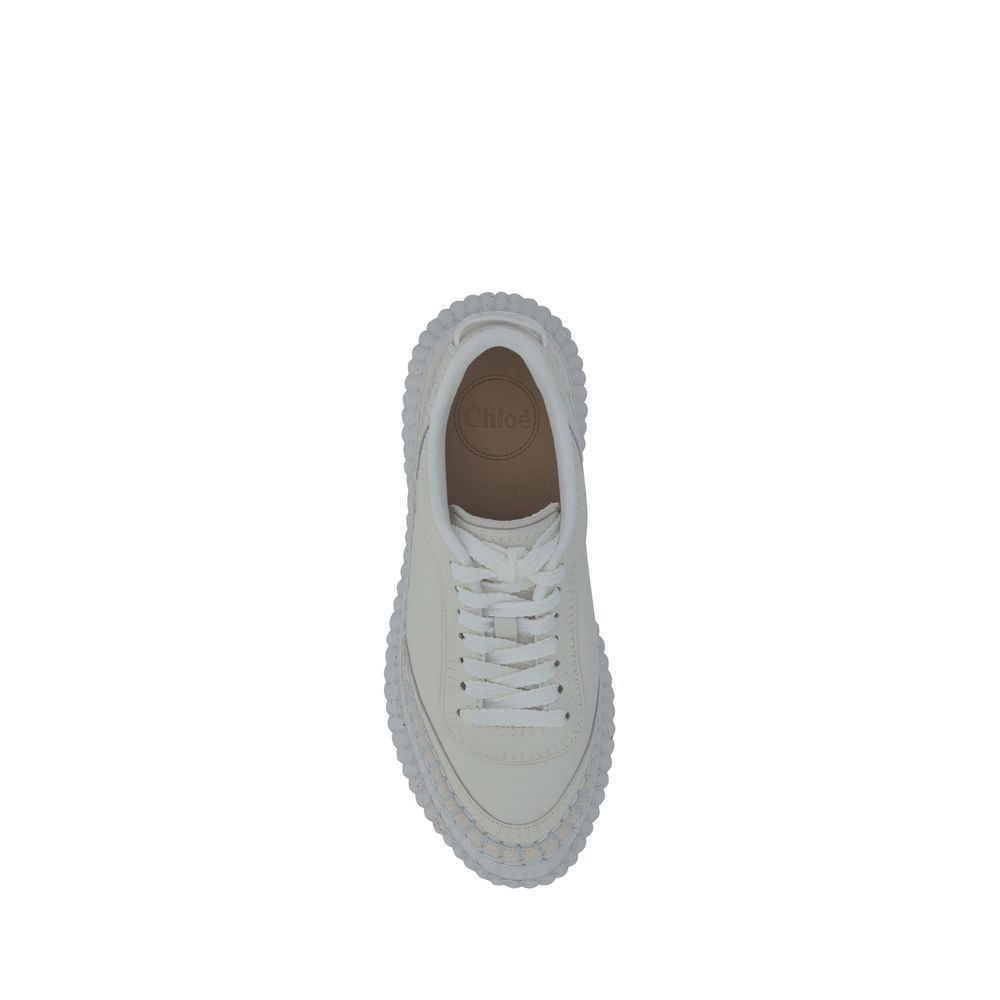 White Calf Leather Bos Taurus Platform SneakersCalfskin nama Sneakers by Chloé, lace-up front closure, mesh design on side panels, crater-effect structured platform sole, iconic brand monogram pressure-stamped at heel, logo-printed insole. Season: AW25 Co