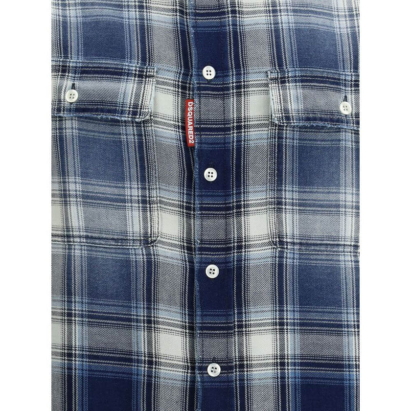 Blue Cotton Pattern ShirtDsquared2’s cotton check Shirt is a garment with a casual and distinctive style, perfect for a contemporary look. The classic collar and front button closure lend a traditional touch, while the two front patch pockets with flap an