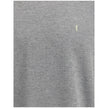 Grey Cotton Oversized T-shirtSaint Laurent’s oversized T-shirt is a casual yet sophisticated piece with a ribbed crew neck for comfort. The brand’s iconic logo, stitched on the front, adds a touch of understated elegance. The mélange pattern gives a sligh