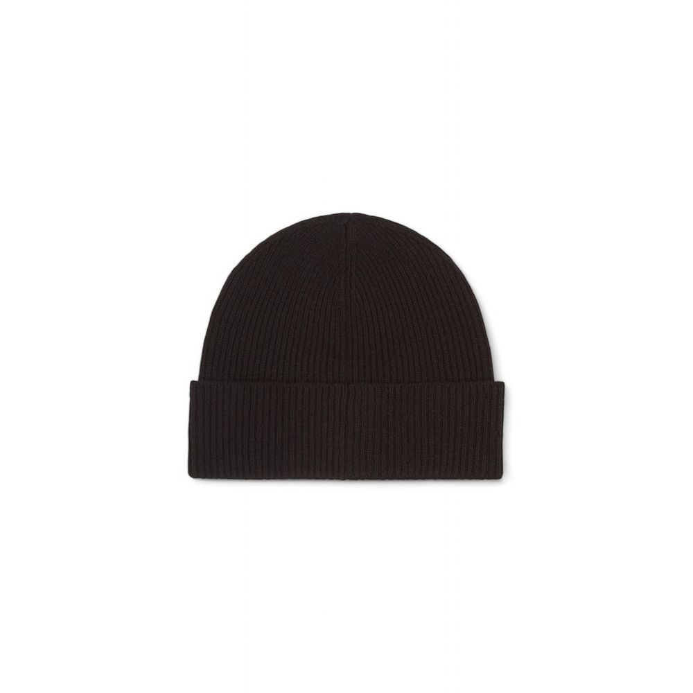 Black Cashmere Caps Baseball HatDiscover the men’s beanie hat by Calvin Klein, a high-quality accessory made from 100% cashmere. This beanie is designed to provide warmth and comfort during the colder days, making it perfect for winter. Its fine craftsman