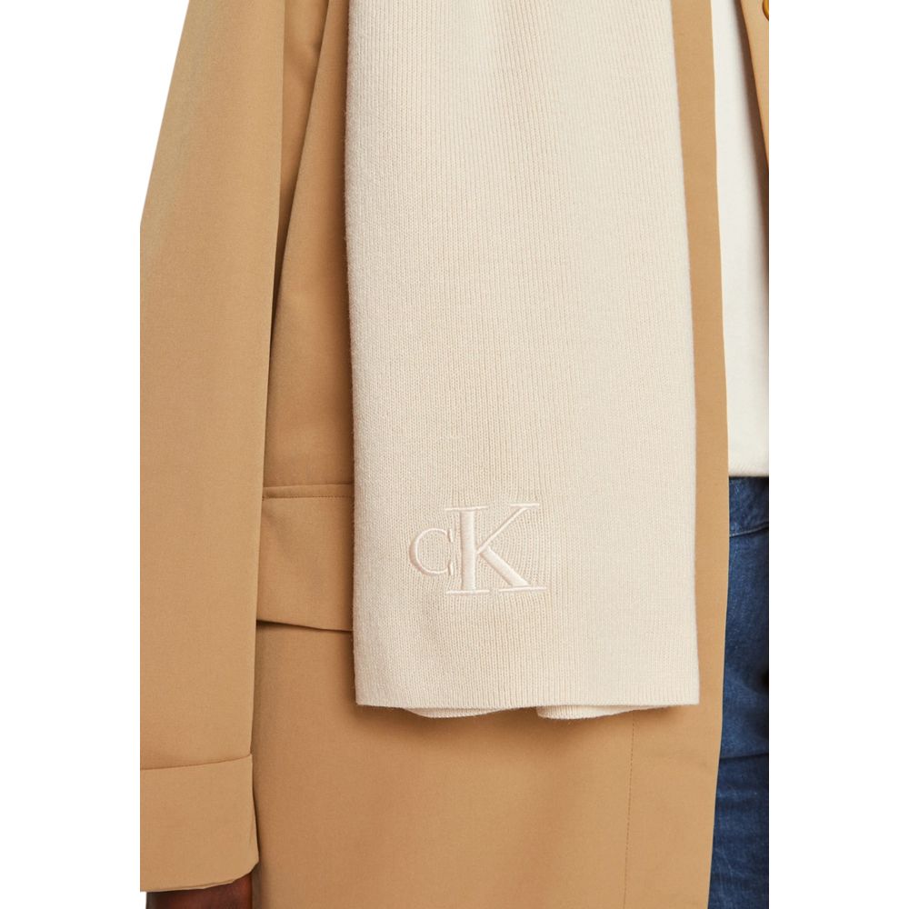 Cream Recycled Polyester ScarfDiscover the Calvin Klein MONOGRAM EMBRO SCARF K60K612659, a stylish and versatile accessory perfect for completing any outfit. Made from 100% recycled polyester, this scarf not only adds a touch of elegance but is also an ec