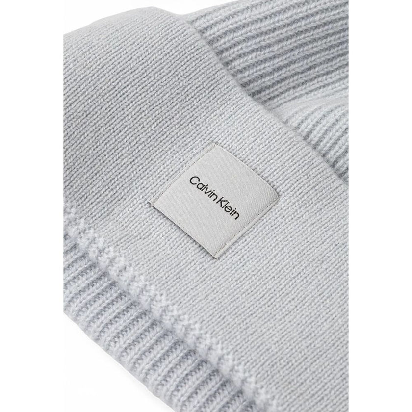 Gray Cashmere Caps Baseball HatThe Calvin Klein chunky open rib beanie is the perfect accessory to complete your winter look. Made from 100% cashmere, it provides an unparalleled softness and warmth. The open rib design adds a touch of elegance and modern