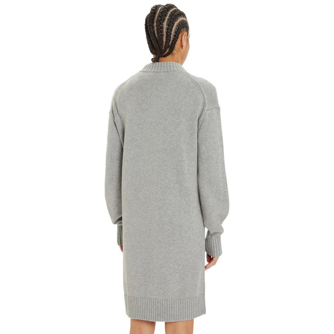 Gray Organic Cotton ShortDiscover the Calvin Klein Jeans CK Intarsia Loose short dress for women, a piece that combines comfort and style. Made from a blend of 55% organic cotton, 35% cotton, and 10% wool, this dress is perfect for cooler days. The loose