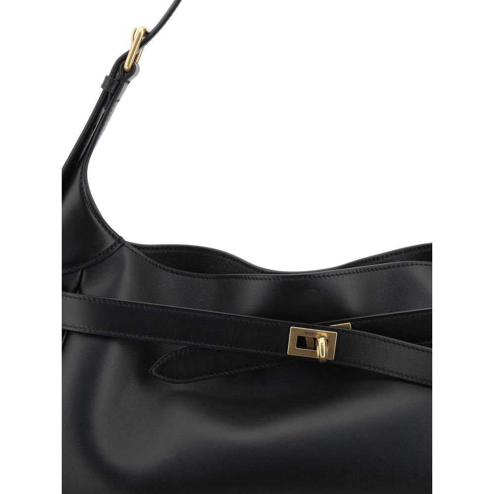 Black Calf Leather Bos Taurus Shoulder BagThe Bel Air Shoulder Bag by Balenciaga is a perfect mix of contemporary elegance and functionality. Crafted from smooth leather, it offers a refined and versatile design. The adjustable handle allows it to be easi