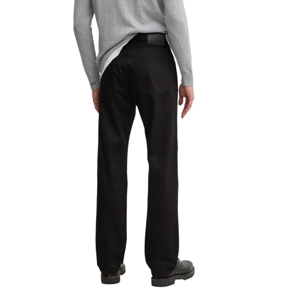Black Cotton Relaxed Fit JeanDiscover the Calvin Klein Jeans STANDARD STRAIGHT J30J325966 regular/loose fit jeans for men, made from 100% cotton for optimal comfort. These jeans feature a straight and relaxed fit, perfect for any occasion, from leisure ti