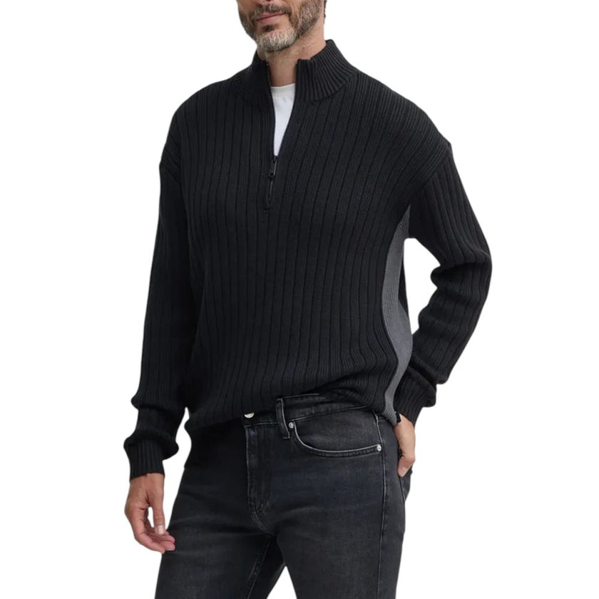 Black Cotton CardiganDiscover the Calvin Klein Jeans LINEAR HALF ZIP SWEA J30J326199 men’s cardigan, a versatile and trendy clothing piece. Made from high-quality materials, 85% cotton and 15% acrylic, this cardigan offers exceptional comfort and a pleasa