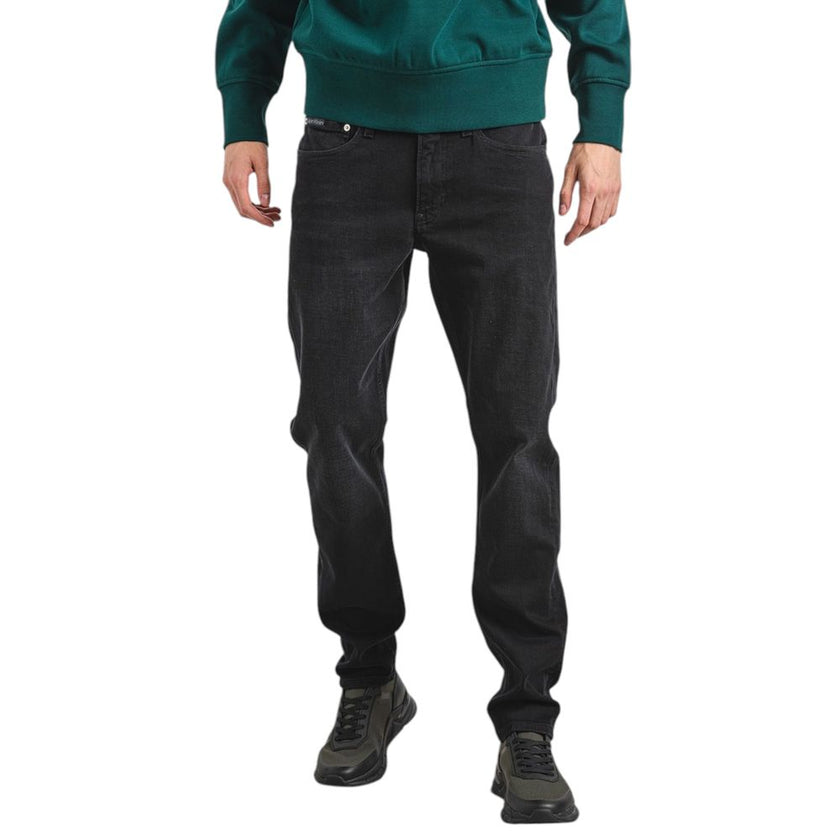 Black Cotton Slim Fit JeanDiscover the Calvin Klein Jeans SLIM TAPER J30J326842 tapered jeans for men, an essential piece for your wardrobe. Made from high-quality materials, these jeans feature 92% cotton, 6% elastomultiester, and 2% elastane/lycra, ensu