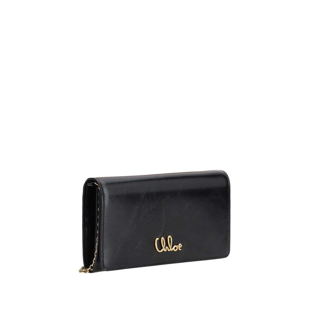 Brown Calf Leather Bos Taurus Clutch BagThe Chloé Iconic Pochette is a sophisticated and elegant accessory, perfect for adding a touch of class to every look. The compact and refined design is enriched by the removable chain shoulder strap, which allows i