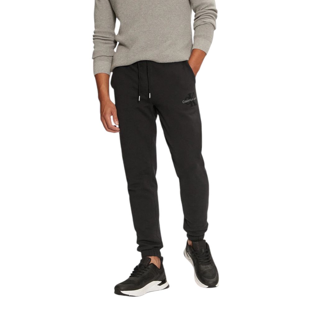 Black Organic Cotton Joggers Workout PantThe Calvin Klein Jeans CHENILLE MONOLOGO SW J30J326685 men’s sweatpants are made from 100% organic cotton, ensuring exceptional comfort and a soft feel against the skin. These pants are perfect for daily activities